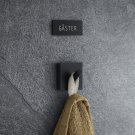 svart skylt till gästhandduk gäster